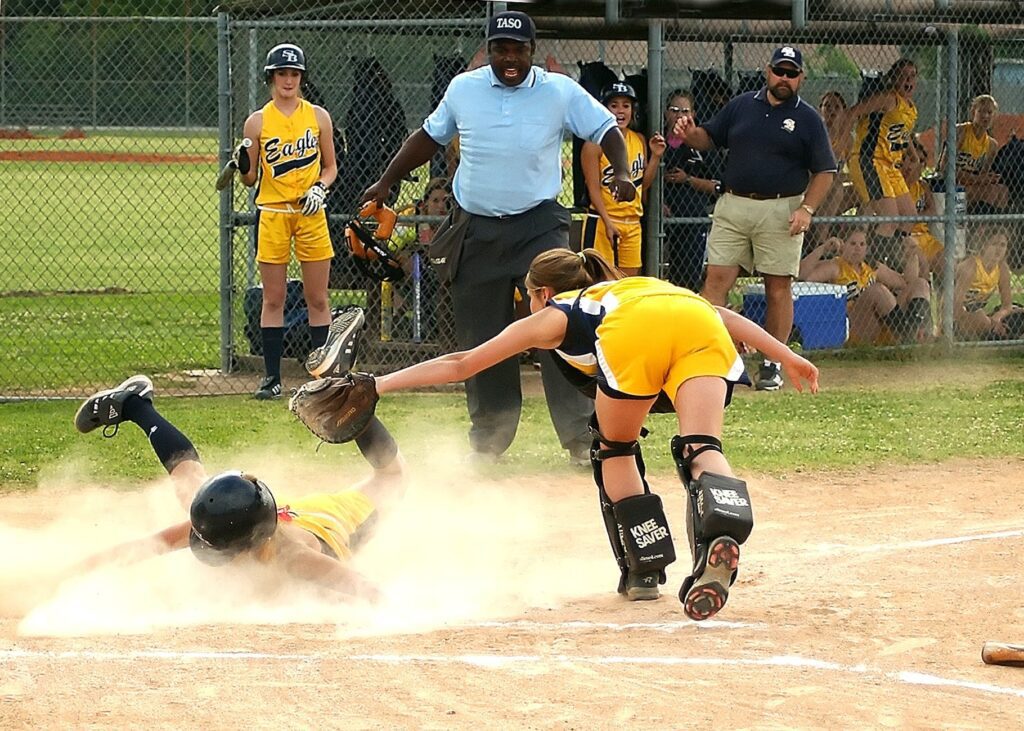 girls playing softball catcher tag out runner